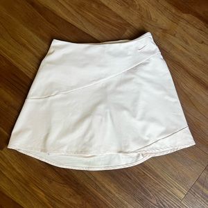 Light pink/cream Nike dry-fit tennis shirt.